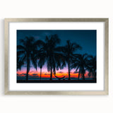 Abstract art print of a Caribbean scene in muted blue and green tones, framed in silver, suitable for dining room decor.
