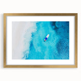 Abstract art print featuring Caribbean scenery in muted blue and green tones on a framed canvas.