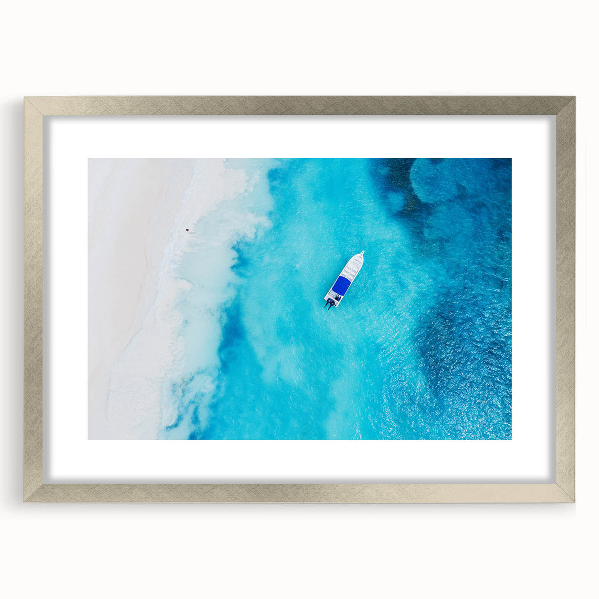 Extra large abstract art print of Caribbean scenery in silver frame, featuring textured blue and green tones.