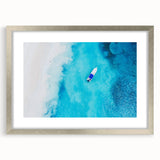 Extra large abstract art print of Caribbean scenery in silver frame, featuring textured blue and green tones.