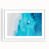 Abstract textured art print of a Caribbean scene in muted blue and green tones, framed with a white mat.