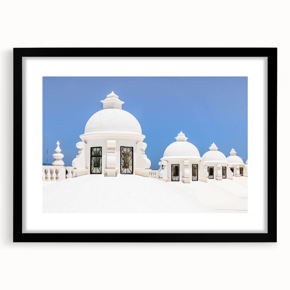 Extra large, colorful art print depicting an abstract Central American scenery in vibrant hues on a black framed canvas.