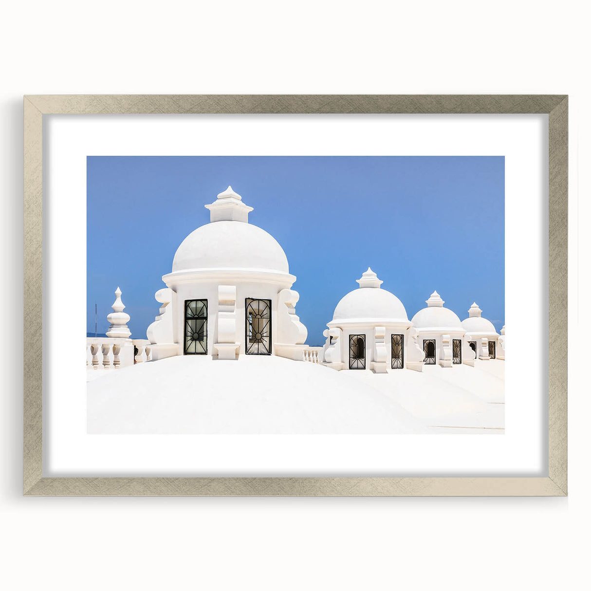 Abstract art print of a Central American landscape in muted earth tones on a framed silver mat, ideal for dining room decor.