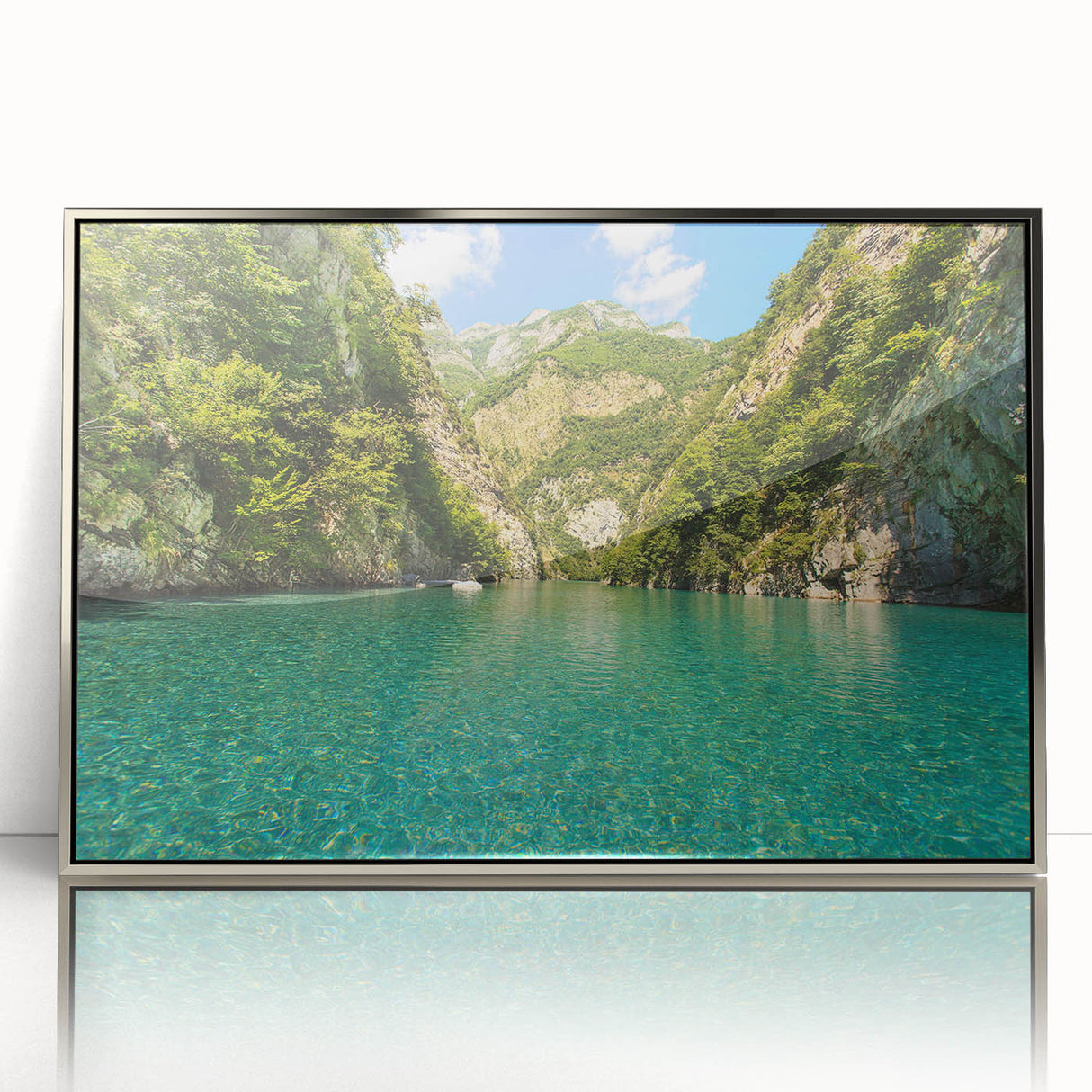 Mid-century modernist acrylic print of a serene Albanian landscape in cool blue and green tones, framed in silver.
