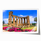 Rolled print of a European Cyprus landscape with lush floral elements in soft green and pink tones.