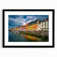 Abstract art print of a European scenery in vibrant colors on a textured, extra large canvas, framed with a black mat.