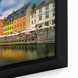 Black wall art featuring a textured, colorful European cityscape on a large framed canvas, ideal for living room decor.