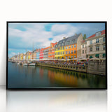 Large abstract wall art depicting a European Denmark scenery in muted gray and blue tones, framed in black acrylic.