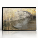 Large abstract wall art depicting a European scenery, in muted earth tones on a black framed acrylic.