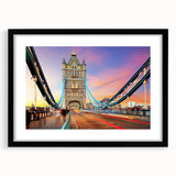 Colorful abstract art print of London scenery in vibrant hues, framed in black, ideal for living room decor.