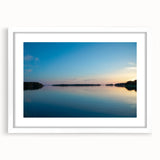 Textured abstract art print of a serene Finnish landscape in muted earth tones, framed with a white mat.