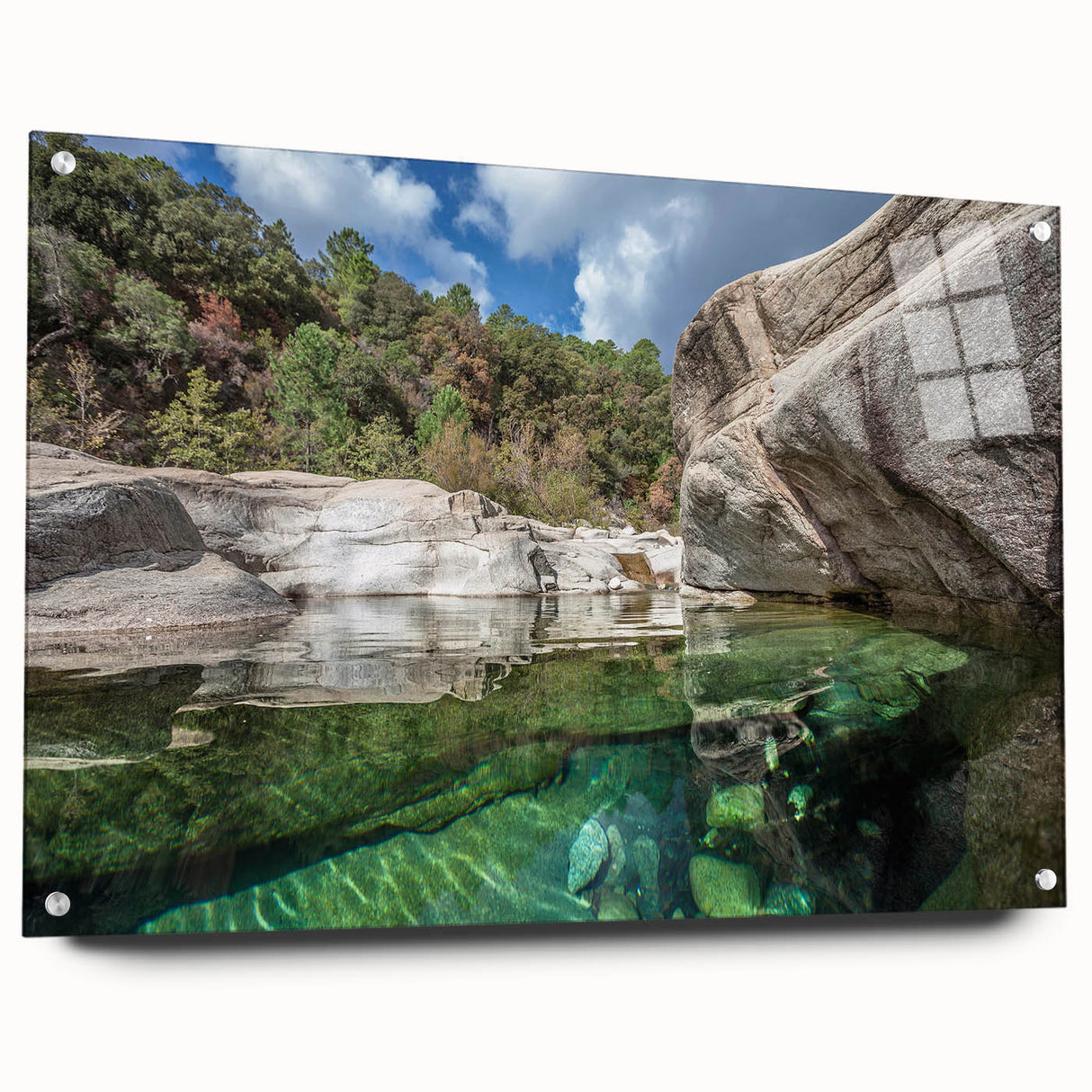 Large abstract wall art of Corsica coastline in muted blue and green tones on acrylic glass.