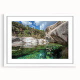 Textured abstract art print of a Corsican landscape in subdued earth tones, framed with a white mat, ideal for bedroom decor.