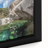 Black wall art featuring a textured Corsican landscape with vibrant, colorful accents on a framed canvas.