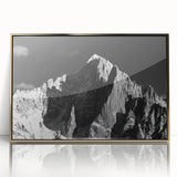 Acrylic print of the French Alps in subtle earth tones, framed in gold, suitable as modern art wall decor for a nursery.