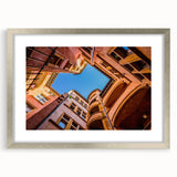 Abstract art print of Lyon scenery in textured silver frame, using muted earth tones, ideal for living room decor.