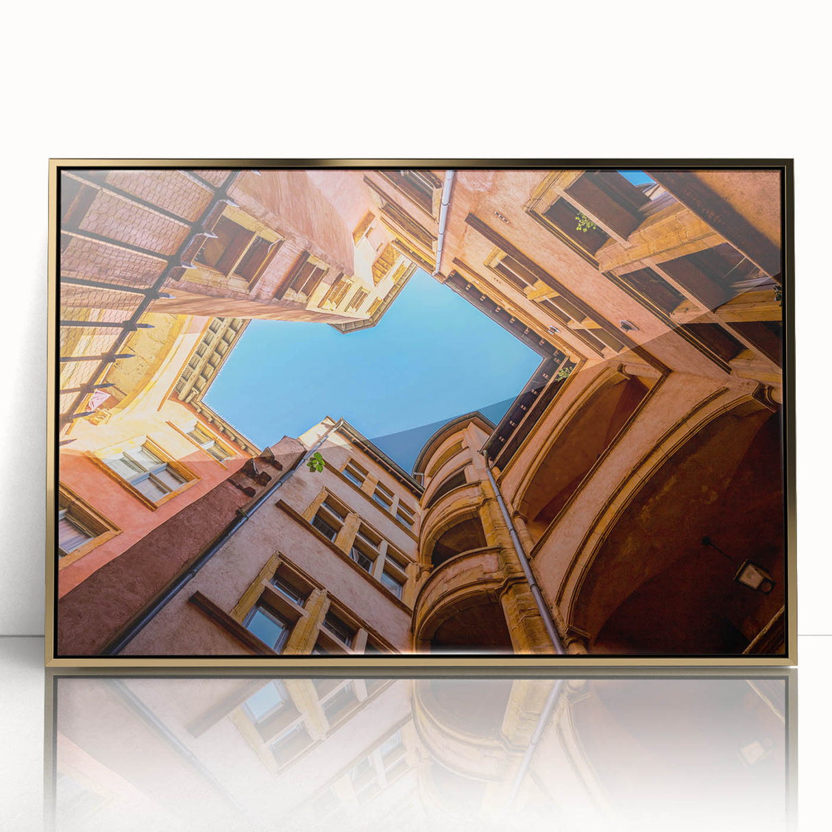 Art deco poster of Lyon, France, in gold acrylic frame, featuring muted earth tones, ideal for modern art wall decor.