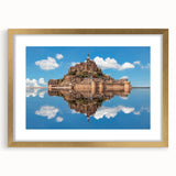 Abstract art print depicting the Normandy coastline in muted gray and blue tones, framed in gold.