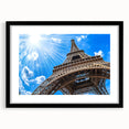 Colorful abstract art print of Paris scenery in vibrant hues on a large framed canvas, ideal for living room decor.
