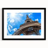 Colorful abstract art print of Paris scenery in vibrant hues on a large framed canvas, ideal for living room decor.