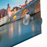 Large abstract wall art depicting a Bavarian landscape in muted green and blue tones on acrylic glass.