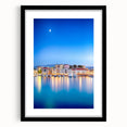 Extra large abstract art print of a vibrant, colorful European seaside scene on a textured canvas, framed in black.