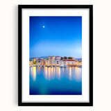 Extra large abstract art print of a vibrant, colorful European seaside scene on a textured canvas, framed in black.