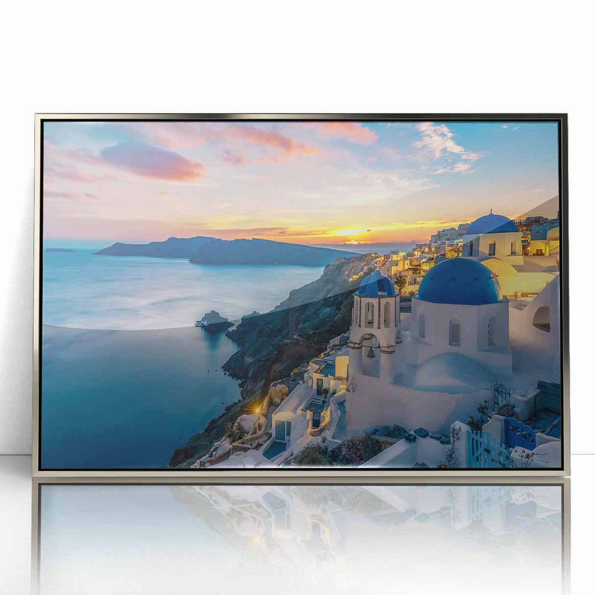 Acrylic print of Santorini scenery with blue and white tones, framed in silver, suitable as modern art wall decor.