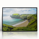 Large abstract wall art depicting a serene Irish landscape in muted green and blue tones, framed in black acrylic.