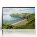 Large art print of a scenic Irish landscape in muted green and blue tones, framed in silver acrylic.