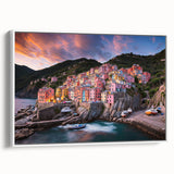 Vintage poster art of Cinque Terre with vibrant colors on a framed canvas, ideal for living room decor.