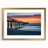 Abstract art print of Naples scenery in muted gold and blue tones, framed with a gold mat, suitable for dining room decor.