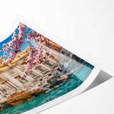 Extra large wall art featuring line art flowers over a scenic view of Rome, in muted earth tones.