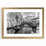 Abstract art print of a Venetian scene in muted gold and blue tones on a framed canvas, suitable for dining room decor.