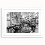 Textured abstract art print of Venice scenery in muted earth tones, framed with a white mat, ideal for bedroom decor.