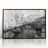Large abstract wall art depicting a stylized Venice scenery in muted earth tones, framed in black acrylic.