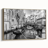 Framed canvas of a Venice landscape in muted gold and black tones, ideal for bedroom wall art.