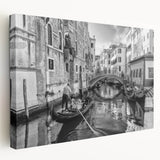 Side view of a stretched canvas depicting a serene Venice canal, with muted blue and gray tones, ideal for kitchen wall art.