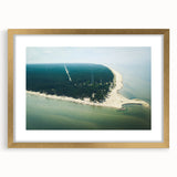 Abstract art print of a European landscape in muted gold and green tones, framed with a gold mat.