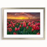 Extra large abstract art print of a European scenery in muted blue and green tones, framed in silver.