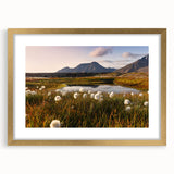 Abstract art print featuring a stylized Norwegian landscape in muted blue and green tones, framed in gold.