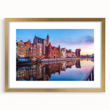 Abstract art print of a European scenery in muted earth tones, framed in gold, suitable for dining room or bedroom decor.