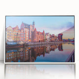 Mid-century modernist art depicting a serene European landscape, in soft pastel shades on framed acrylic.