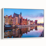 Vintage poster art of a European cityscape in vibrant colors on a large framed canvas, ideal for living room decor.