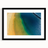 Abstract art print of a colorful, textured European scenery in vibrant hues, framed in black, ideal for living room decor.