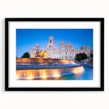Abstract art print of Madrid with vibrant colors and textures on a large black-framed canvas, ideal for living room decor.