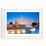 Abstract art print of Madrid skyline in muted gray and blue tones on a framed white mat, ideal for dining room decor.