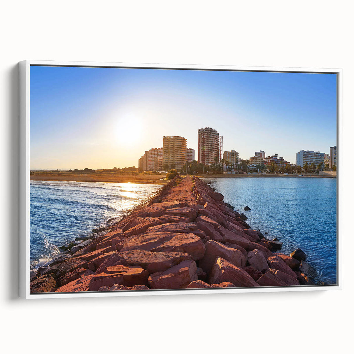 Vintage poster art of Valencia scenery, featuring colorful art on a white-framed canvas, ideal for living room decor.
