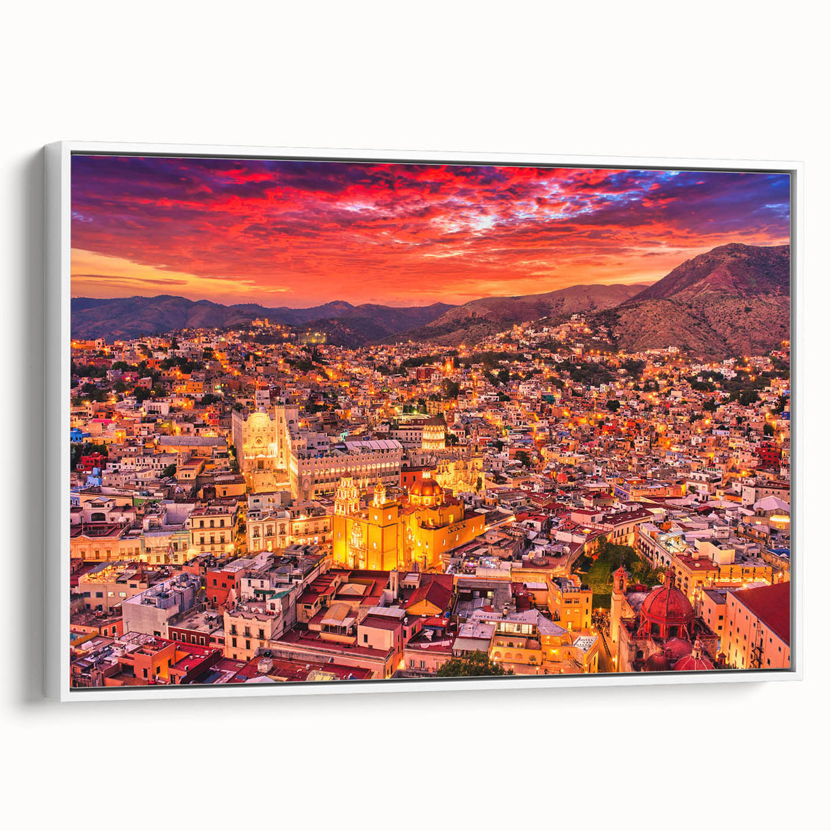 Vintage poster art of Guanajuato, Mexico, featuring colorful buildings on framed canvas, suitable for living room decor.