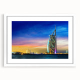 Abstract art print of Dubai skyline in muted gold and blue tones on a white matted frame, suitable for dining room decor.